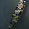 Local vendor selling fresh produce on a rowing boat at Tha Kha floating market