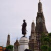 The statue of King Rama II at Wat Arun, temple of Dawn. Visit this iconic temple on our private tours in Bangkok.