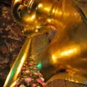 The Reclining Buddha at Wat Pho. Visit the reclining Buddha temple on our private Bangkok city tours.