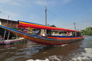 Explore local life on a canal tour in Bangkok by private long-tailed boat. See old wooden houses on stilts and local life along the canals.