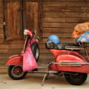 A Vespa is commonly seen transporting goods on the streets of Chinatown