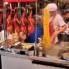 A busy local restaurant selling noodles with duck in Chinatown