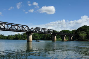 Visit Bridge on the River Kwai on a tour from Bangkok to Kanchanaburi. The bridge is part of the infamous Death Railway.