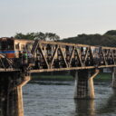 Train crossing the famous Bridge over the River Kwai in Kanchanaburi