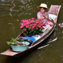 Floating flower shop at Damnoen Saduak floating market. See it on our private floating market tour from Bangkok.