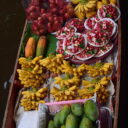 Local fruits for sale on a boat at Damnoen Saduak floating market