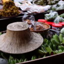 Goods on sale at Damnoen Saduak floating market. Enjoy local fruits and snacks on our floating market tour from Bangkok.