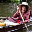 A vendor with steamed snacks rowing by at Damnoen Saduak floating market