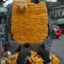 A truck unloading marigolds at the flower market to be made into garlands 