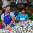 Stall selling vegetable and steamed mackerels at Khlong Toey Market