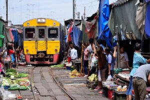 Visit Mae Klong railway market on a tour from Bangkok ✅. A fresh market located on the tracks of a railway.