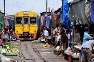 Visit Mae Klong railway market on a tour from Bangkok ✅. A fresh market located on the tracks of a railway.