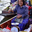 A vendor selling chilli paste at Tha Kha floating market