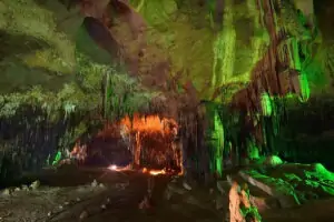 Visit Tham Khao Bin cave on a tour from Bangkok ✅. The cave is separated in eight rooms with impressive stalactite and stalagmite formations.
