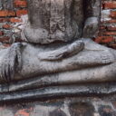 A Buddha image at Wat Mahathat temple ruin in Ayutthaya