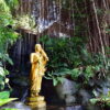 A Buddha image at a garden in the compound of Wat Saket, temple of the Golden Mount in Bangkok