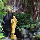 A Buddha image at a garden in the compound of Wat Saket, temple of the Golden Mount in Bangkok